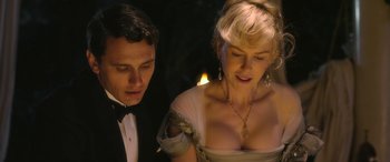 Movie still from “Queen of the Desert” (2015), directed by Werner Herzog – A man and a woman in evening wear looking at each other; Close Up shot, Over the shoulder angle