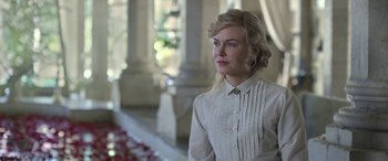 Movie still from “Queen of the Desert” (2015), directed by Werner Herzog – A woman with blonde hair wearing a white shirt; Close Up shot, Over the shoulder angle