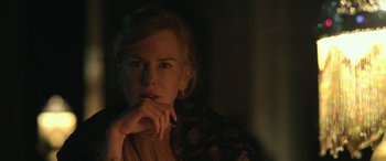 Movie still from “Queen of the Desert” (2015), directed by Werner Herzog – A woman with her hand under her chin; Close Up shot, Over the shoulder angle