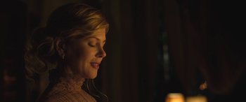 Movie still from “Queen of the Desert” (2015), directed by Werner Herzog – A beautiful woman with her eyes closed in the dark; Close Up shot, Over the shoulder angle