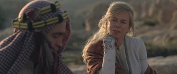 Movie still from “Queen of the Desert” (2015), directed by Werner Herzog – A man and a woman are standing next to each other; Close Up shot, Over the shoulder angle