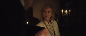Movie still from “Queen of the Desert” (2015), directed by Werner Herzog – A woman in a white shirt is talking to someone; Close Up shot, Over the shoulder angle