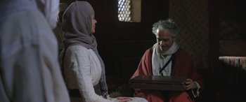 Movie still from “Queen of the Desert” (2015), directed by Werner Herzog – A man and a woman are talking to each other; Medium shot, Over the shoulder angle