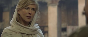 Movie still from “Queen of the Desert” (2015), directed by Werner Herzog – A woman with a white scarf around her neck; Close Up shot, Over the shoulder angle