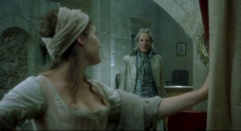 Movie still from “Quills” (2000), directed by Philip Kaufman – A man and a woman are looking in a mirror; Medium shot, Over the shoulder angle