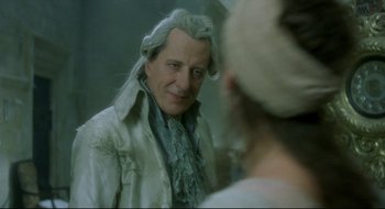 Movie still from “Quills” (2000), directed by Philip Kaufman – A man in a wig looking at himself in a mirror; Close Up shot, Over the shoulder angle