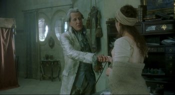 Movie still from “Quills” (2000), directed by Philip Kaufman – A man and a woman in a room; Medium shot, Over the shoulder angle