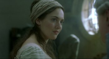 Movie still from “Quills” (2000), directed by Philip Kaufman – A young woman with a head band is posing for a picture; Close Up shot, Over the shoulder angle