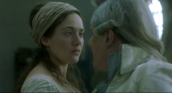 Movie still from “Quills” (2000), directed by Philip Kaufman – A young woman and an older man face to face; Close Up shot, Over the shoulder angle