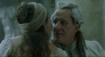 Movie still from “Quills” (2000), directed by Philip Kaufman – An older man and a young woman looking at each other; Close Up shot, Over the shoulder angle