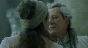 Movie still from “Quills” (2000), directed by Philip Kaufman – A man and a woman face to face in front of a mirror; Close Up shot, Over the shoulder angle