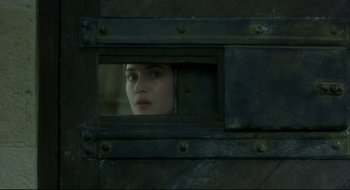 Movie still from “Quills” (2000), directed by Philip Kaufman – A woman looking out of a train window; Close Up shot, High angle