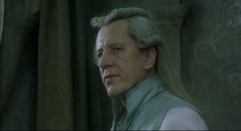 Movie still from “Quills” (2000), directed by Philip Kaufman – A person with long hair; Close Up shot, Low angle