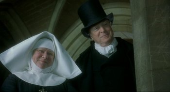 Movie still from “Quills” (2000), directed by Philip Kaufman – A man and a woman dressed up in costume; Close Up shot, Low angle