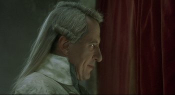 Movie still from “Quills” (2000), directed by Philip Kaufman – A person wearing a wig; Close Up shot, Over the shoulder angle