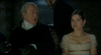 Movie still from “Quills” (2000), directed by Philip Kaufman – A man and a woman sitting next to each other on a couch; Close Up shot, Over the shoulder angle