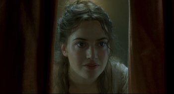 Movie still from “Quills” (2000), directed by Philip Kaufman – A young woman looking into a mirror with her eyes wide open; Close Up shot, Over the shoulder angle
