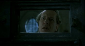 Movie still from “Quills” (2000), directed by Philip Kaufman – A man looking at his reflection in a mirror; Close Up shot, Low angle