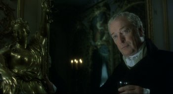 Movie still from “Quills” (2000), directed by Philip Kaufman – An older man holding a wine glass in front of a mirror; Close Up shot, Over the shoulder angle