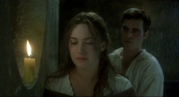 Movie still from “Quills” (2000), directed by Philip Kaufman – A young woman and a young man are looking into the distance; Close Up shot, Over the shoulder angle