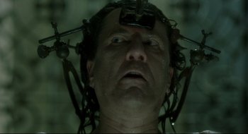 Movie still from “Quills” (2000), directed by Philip Kaufman – A man with a bunch of wires attached to his head; Close Up shot, Low angle