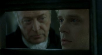 Movie still from “Quills” (2000), directed by Philip Kaufman – A man and a man looking at each other in a mirror; Close Up shot, Over the shoulder angle