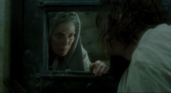 Movie still from “Quills” (2000), directed by Philip Kaufman – An older woman looking in the mirror while a younger woman looks on; Close Up shot, Over the shoulder angle