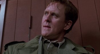 Movie still from “Raising Cain” (1992), directed by Brian De Palma – A person wearing a jacket; Close Up shot, Low angle