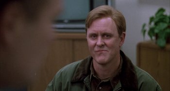 Movie still from “Raising Cain” (1992), directed by Brian De Palma – A person wearing a green jacket; Close Up shot, Over the shoulder angle