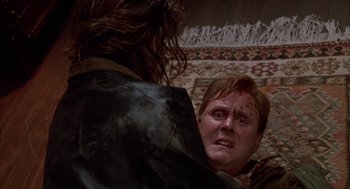 Movie still from “Raising Cain” (1992), directed by Brian De Palma – A man with blood all over his face is looking into a mirror; Close Up shot, Overhead angle