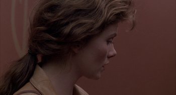 Movie still from “Raising Cain” (1992), directed by Brian De Palma – A person's face in a room; Close Up shot, Over the shoulder angle