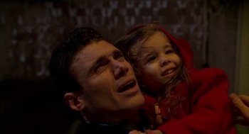 Movie still from “Raising Cain” (1992), directed by Brian De Palma – A man and a little girl looking up at the sky; Close Up shot, High angle