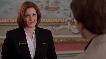 Movie still from “Rat Race” (2001), directed by Jerry Zucker – A woman wearing a suit and tie talking to a man in a suit; Close Up shot, Over the shoulder angle