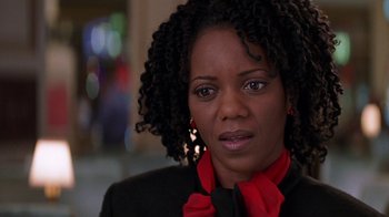 Movie still from “Rat Race” (2001), directed by Jerry Zucker – A person wearing a suit and tie; Close Up shot, Over the shoulder angle