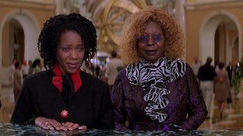 Movie still from “Rat Race” (2001), directed by Jerry Zucker – Two women sitting at a table in front of a mirror; Medium shot, Low angle