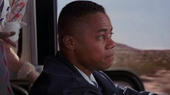 Movie still from “Rat Race” (2001), directed by Jerry Zucker – A person sitting in a car; Close Up shot, Low angle