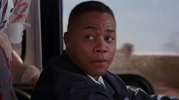 Movie still from “Rat Race” (2001), directed by Jerry Zucker – A person sitting in a car; Close Up shot, Low angle