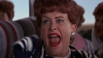 Movie still from “Rat Race” (2001), directed by Jerry Zucker – An older woman with an angry look on her face; Close Up shot, Low angle