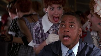 Movie still from “Rat Race” (2001), directed by Jerry Zucker – A man and a woman are looking at the camera; Close Up shot, Low angle