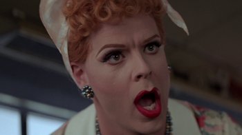 Movie still from “Rat Race” (2001), directed by Jerry Zucker – A person wearing a necklace; Close Up shot, Low angle