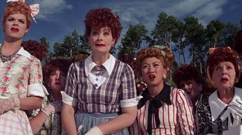 Movie still from “Rat Race” (2001), directed by Jerry Zucker – A group of people dressed up as lucy and ethel from i love lucy; Medium shot, Low angle