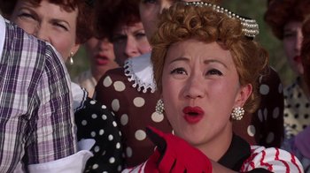 Movie still from “Rat Race” (2001), directed by Jerry Zucker – A group of women dressed up in costumes and makeup; Close Up shot, Low angle