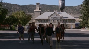 Movie still from “Rat Race” (2001), directed by Jerry Zucker – A group of people walking down a street; Wide shot, High angle