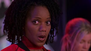 Movie still from “Rat Race” (2001), directed by Jerry Zucker – A person with a surprised look on their face; Close Up shot, Over the shoulder angle