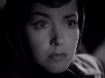 Movie still from “Raw Deal” (1948), directed by Anthony Mann – A woman's face in black and white; Close Up shot, High angle