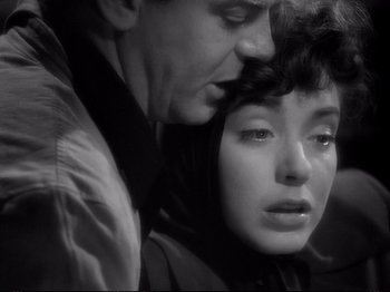 Movie still from “Raw Deal” (1948), directed by Anthony Mann – A black and white photo of a man and a woman; Close Up shot, High angle