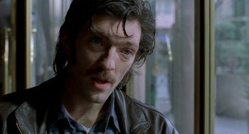 Movie still from “Read My Lips” (2001), directed by Jacques Audiard – A person with long hair; Close Up shot, Low angle