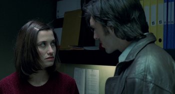 Movie still from “Read My Lips” (2001), directed by Jacques Audiard – A man and a woman talking to each other; Close Up shot, Over the shoulder angle