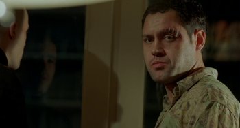Movie still from “Read My Lips” (2001), directed by Jacques Audiard – A person with a scar on his face; Close Up shot, Low angle