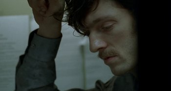 Movie still from “Read My Lips” (2001), directed by Jacques Audiard – A person with their eyes closed; Close Up shot, High angle